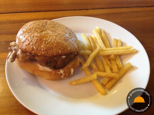 Grilled Chicken Burger accompanied with a handful of French Fries
